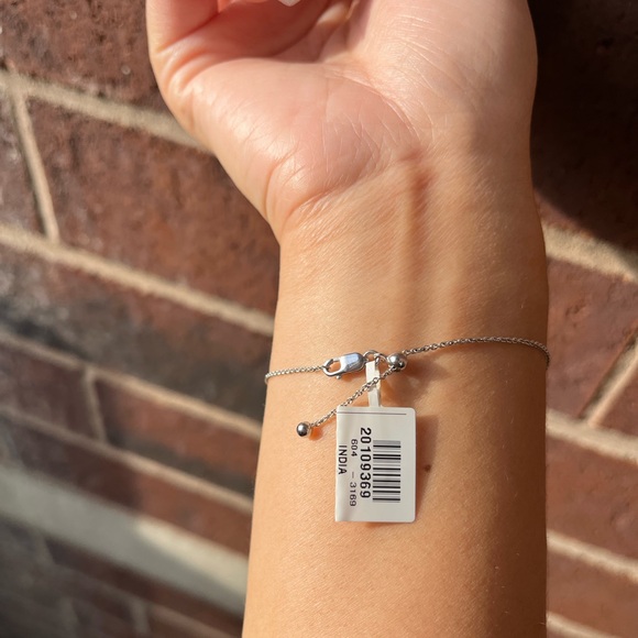 0.04 CT. T.W. Diamond Interlocking Hearts Bracelet in Sterling Silver - 6.75" - Picture 5 of 10